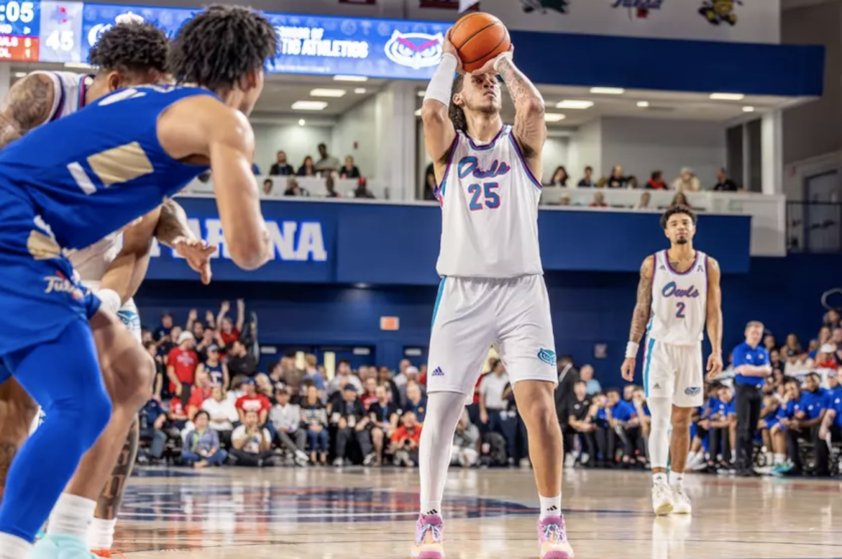 Owls forward Tre Carroll shooting a free throw in their home game against Tulsa Feb. 2, 2024. 